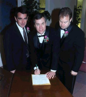 Groom signing the marriage license